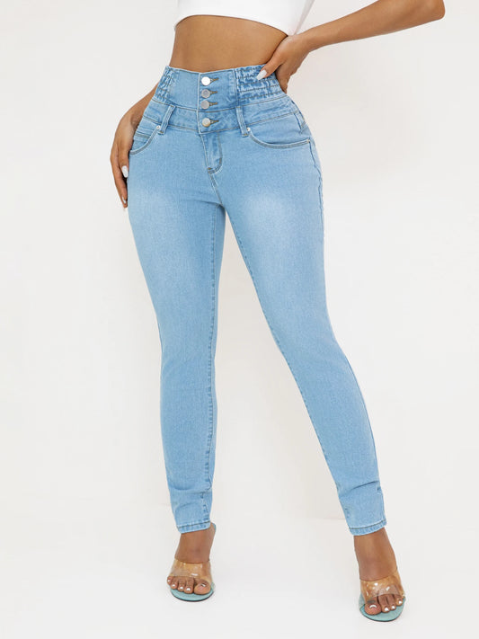 Light blue jeans worn by a person on a white background