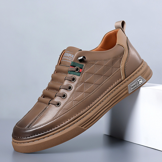 Brown leather sneaker on a light gray background