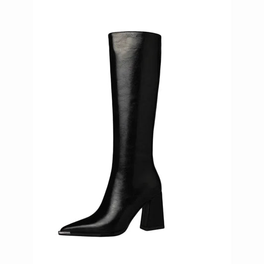 A single black leather knee-high boot with a pointed toe and a chunky block heel, shown in profile against a plain white background.