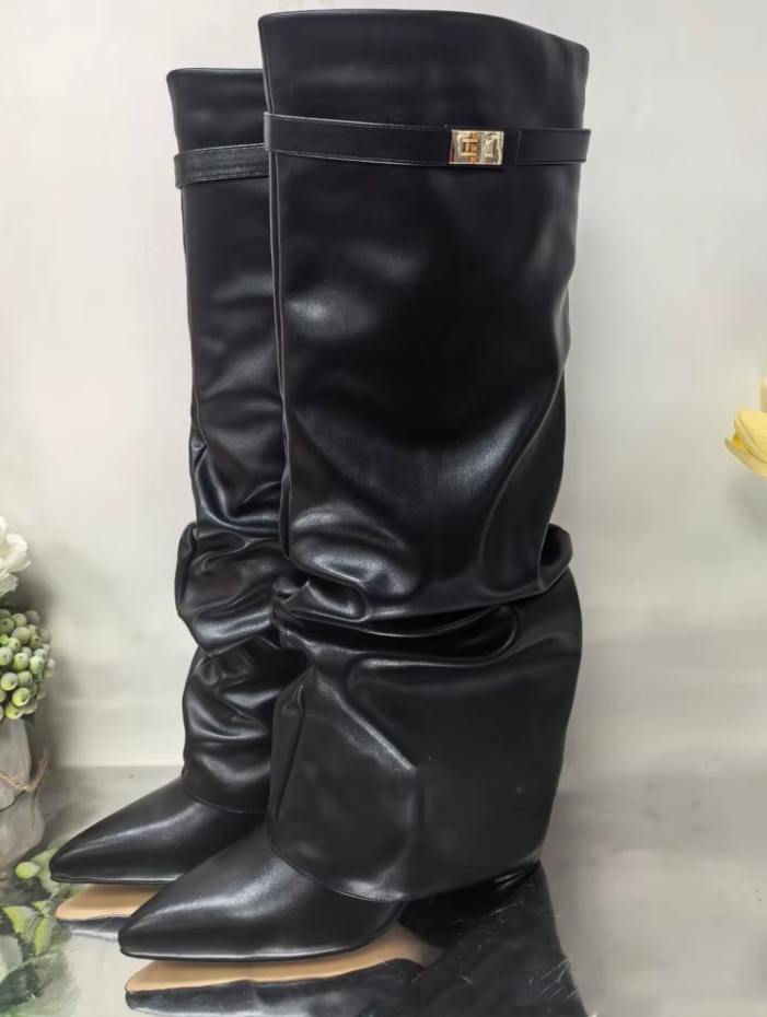 Beige knee-high boots worn with a blackskirt on a white background 2
