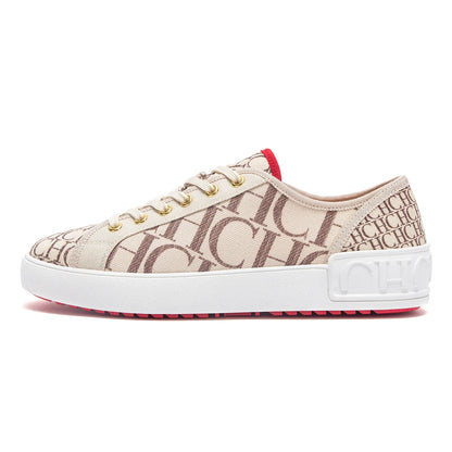 Beige sneaker with brown logo pattern on a white background