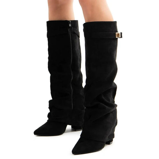 Black knee-high boots with a gold buckle on a white background