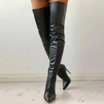 Black leather knee-high boots on a light gray background