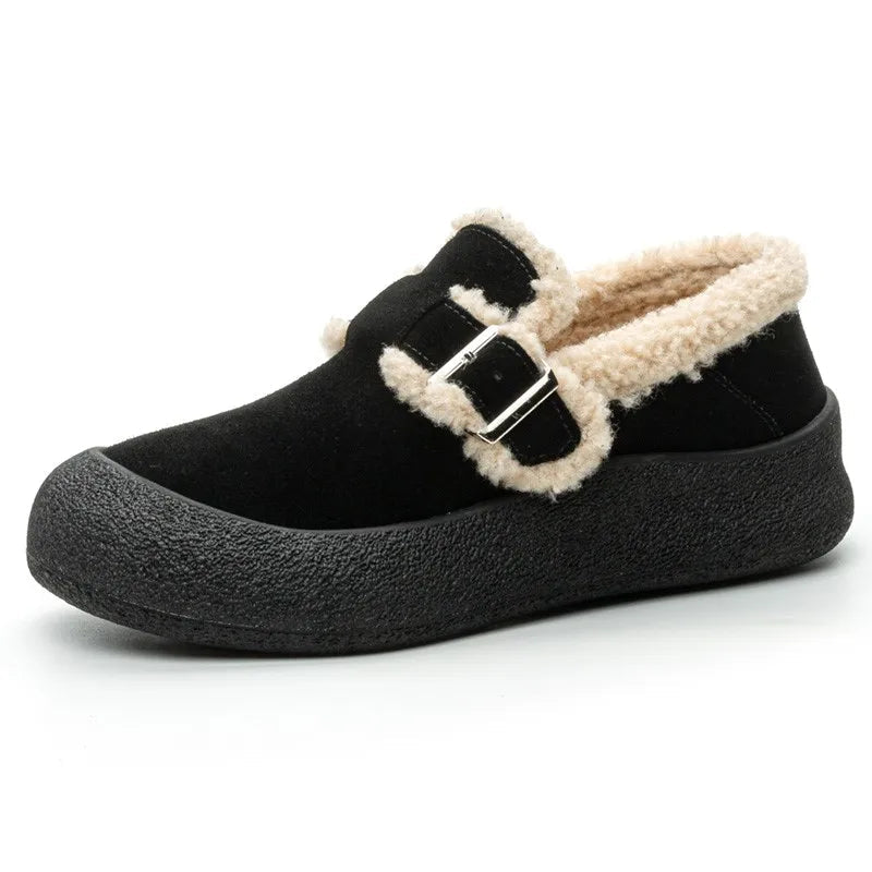 Black slip-on shoe with beige fur lining and a buckle