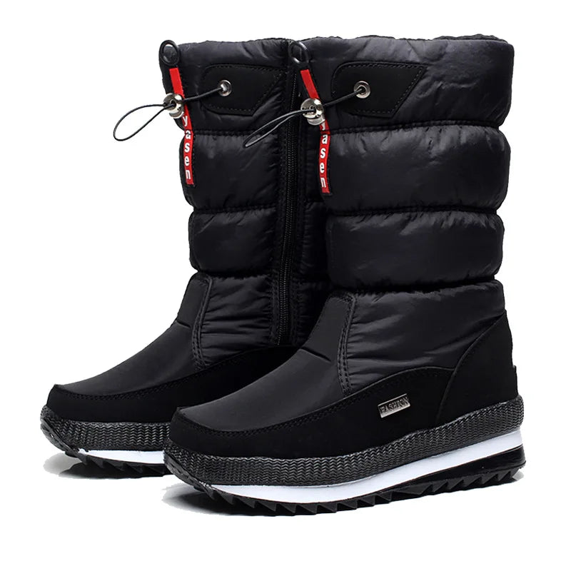 Black winter boots with red zippers on a white background