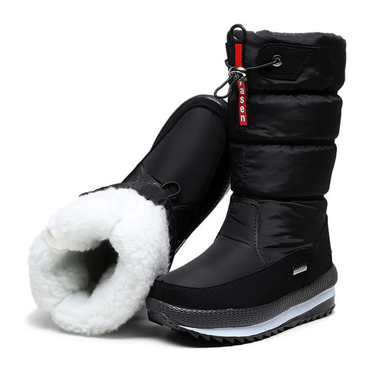Black winter boots with white fur lining on a white background