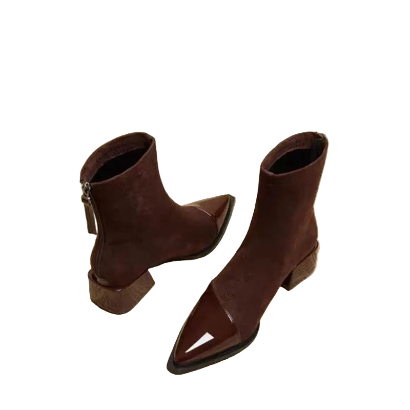 Brown ankle boots on a textured newspaper background