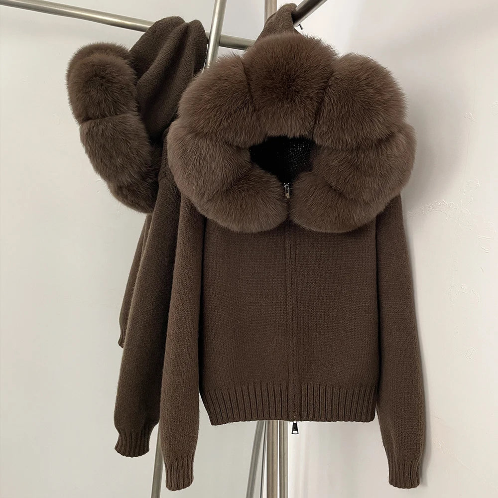 Brown knitted sweater with a large fur collar on a white background