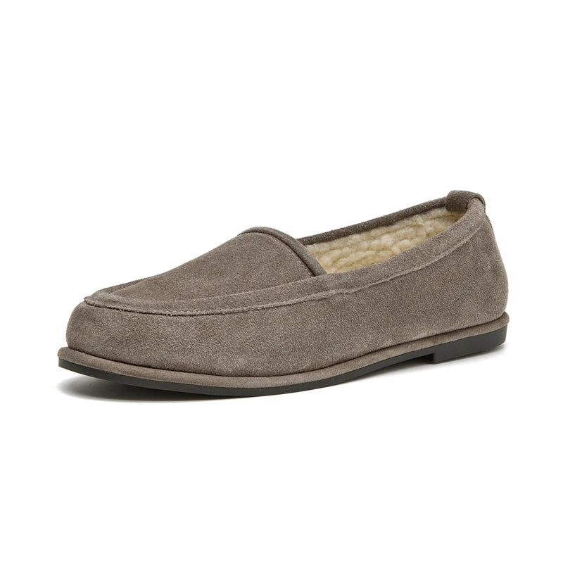 Brown slip-on shoe with shearling lining on a white background