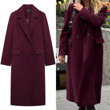 Burgundy coat displayed on a white background and worn by a person outdoors.