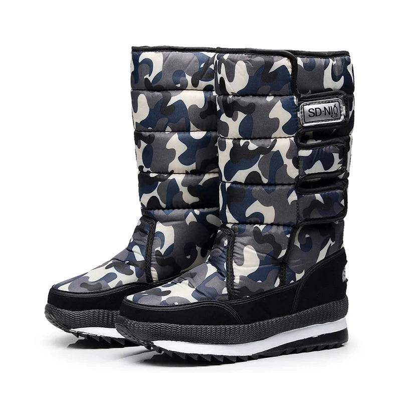 Camouflage-patterned snow boots with a visible brand logo on a white background