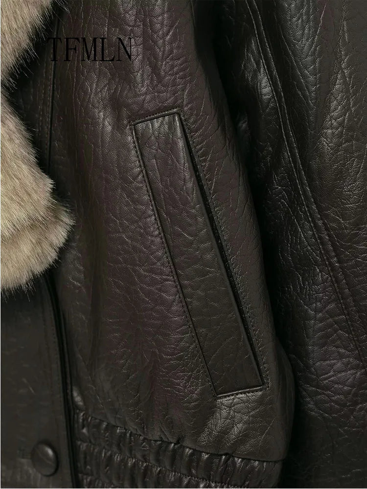 Close-up of a dark brown leather jacket with fur collar.