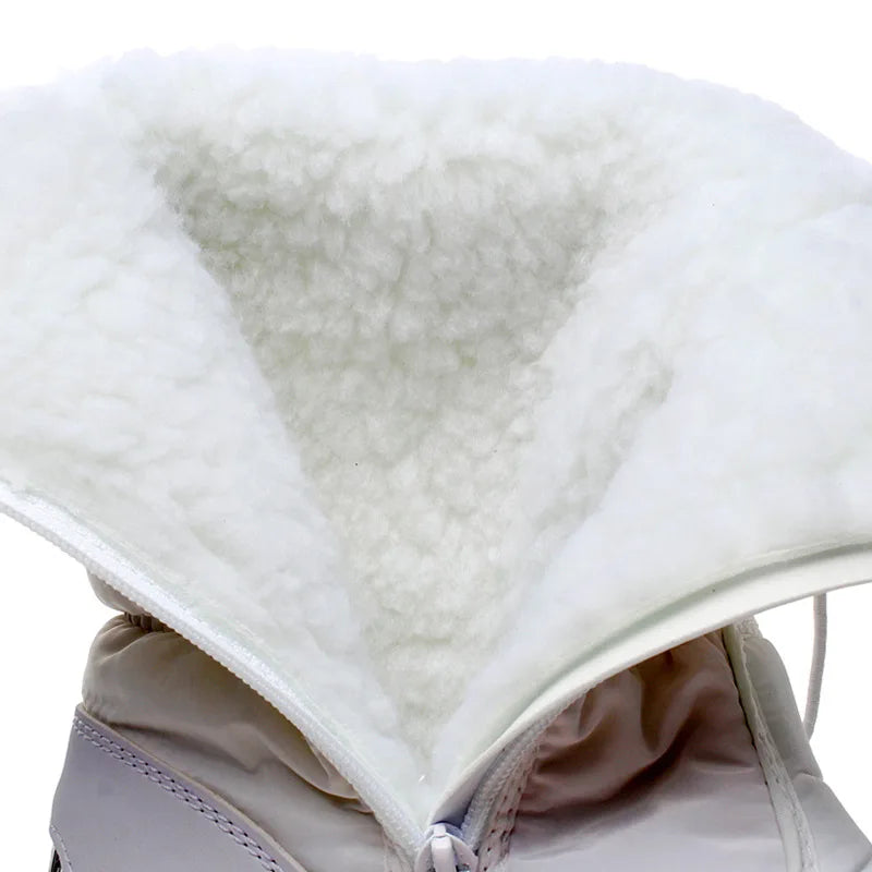 Close-up of a white fleece-lined hood on a jacket with a neutral background