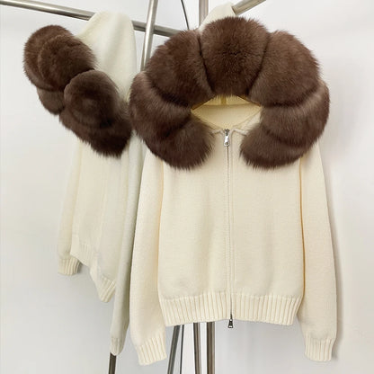Cream-colored jacket with brown fur collar on a stand against a white background