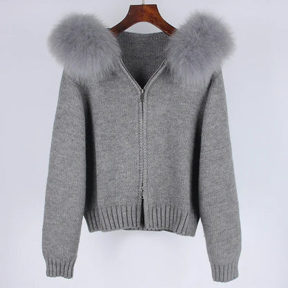 Gray zip-up sweater with faux fur hood on a white background