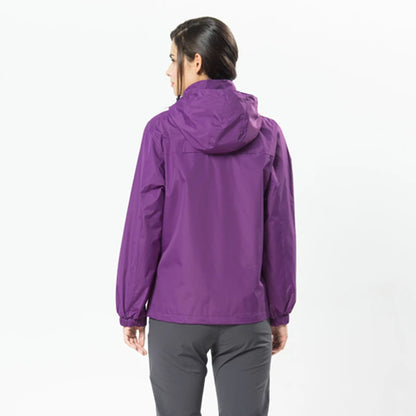 Person wearing a purple raincoat on a white background