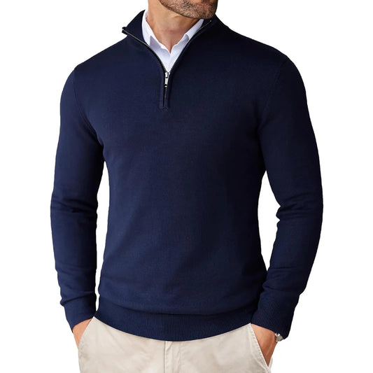 Navy blue quarter-zip sweater worn by a person on a white background