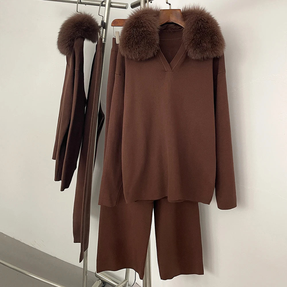 Brown outfit with fur collar on a rack against a white wall