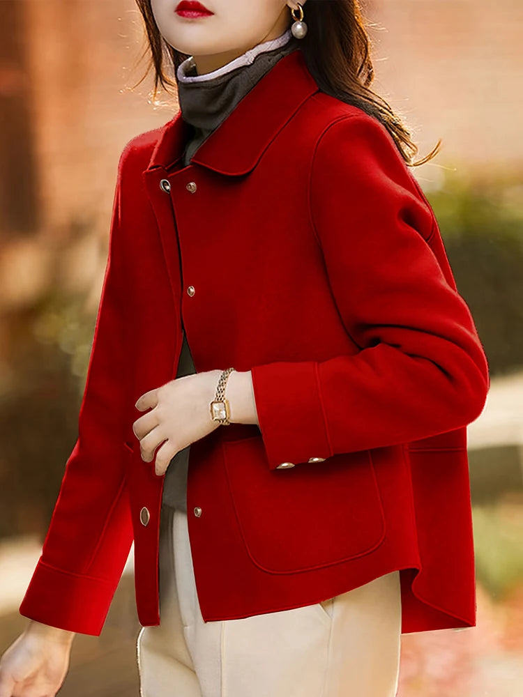 Person wearing a red coat with a blurred background