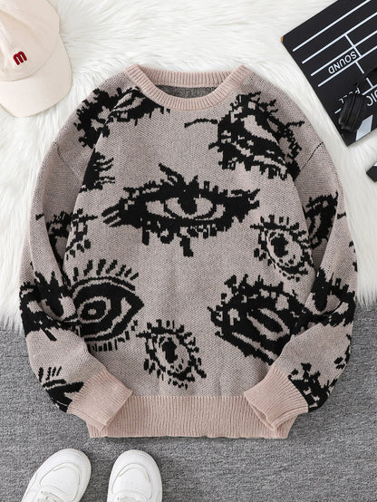 Sweater with eye pattern on a surface with shoes and a cap in the background