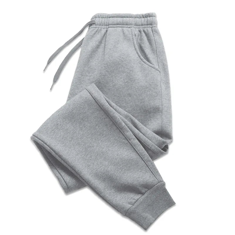 Light gray heathered sweatpants with an elastic drawstring waist and ribbed ankle cuffs, shown on a plain white background.