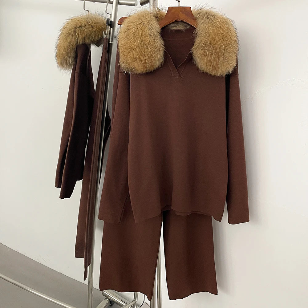 Brown outfit with fur-lined hood on a rack against a white background