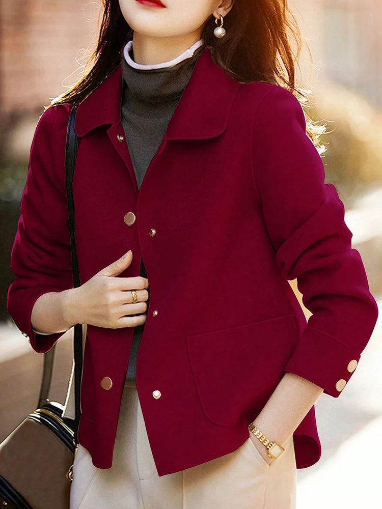 Person wearing a red jacket with a blurred background
