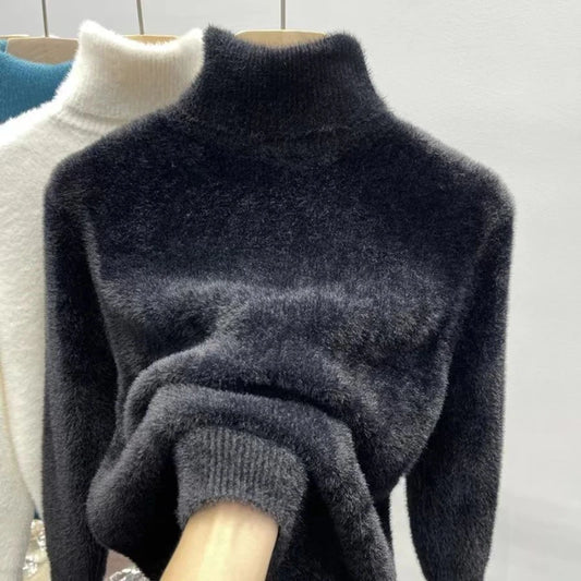 Dark gray turtleneck sweater on a hanger with a white background