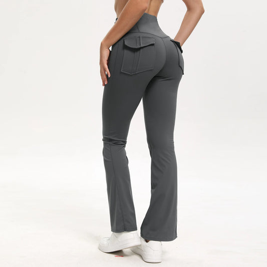 Person wearing gray flared pants on a white background