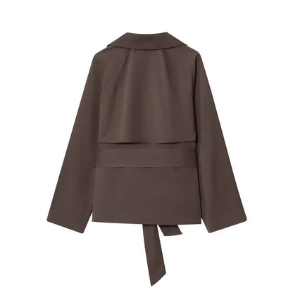 Brown jacket with a belt on a white background, featuring the brand 'ETJ'.