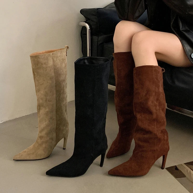 Three pairs of high-heeled knee boots in beige, black, and brown on a neutral background.
