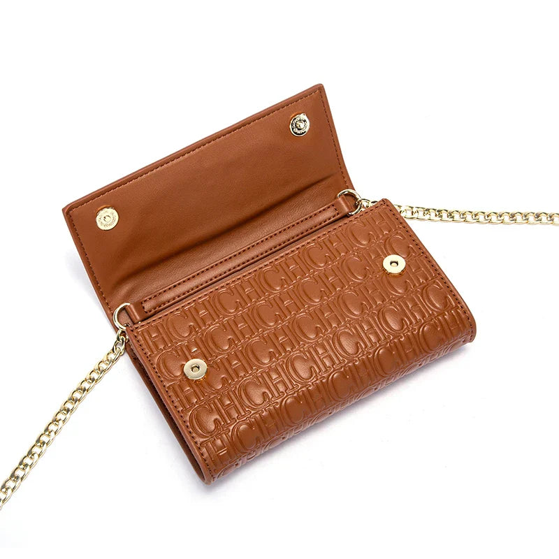 Brown leather wallet with gold chain on a white background