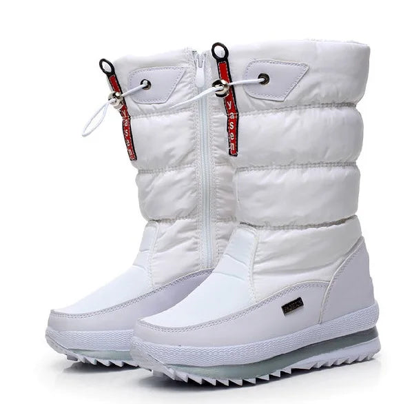White winter boots with red zippers on a white background