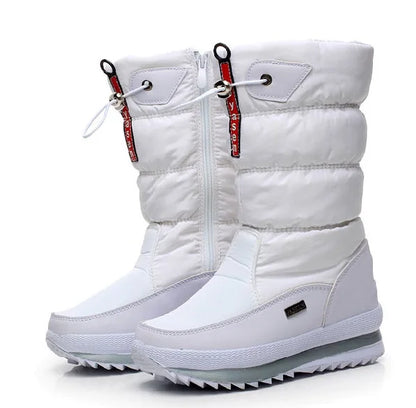 White winter boots with red zippers on a white background