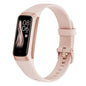 Rose gold fitness tracker with a digital display on a white background