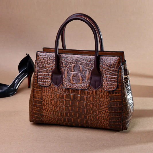 Brown crocodile-patterned handbag with a high-heeled shoe on a beige background