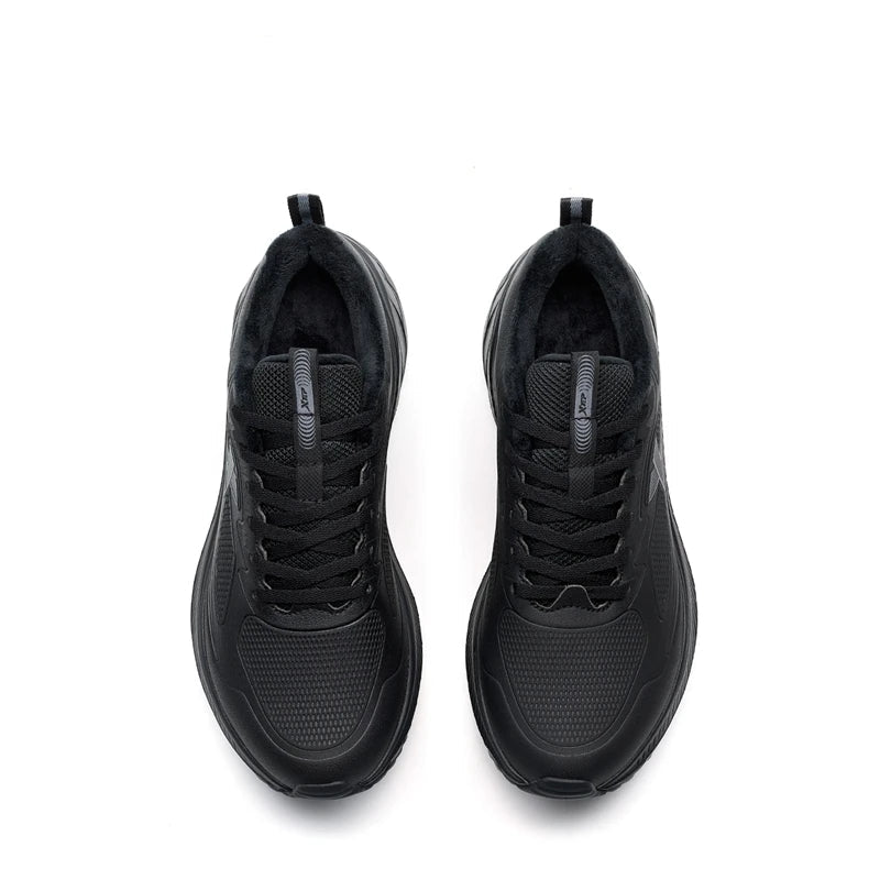 Pair of black athletic shoes on a white background