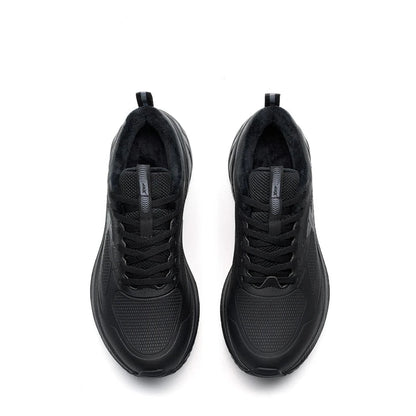Pair of black athletic shoes on a white background