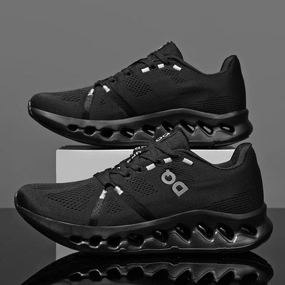 Black athletic shoes with a reflective sole on a gray background