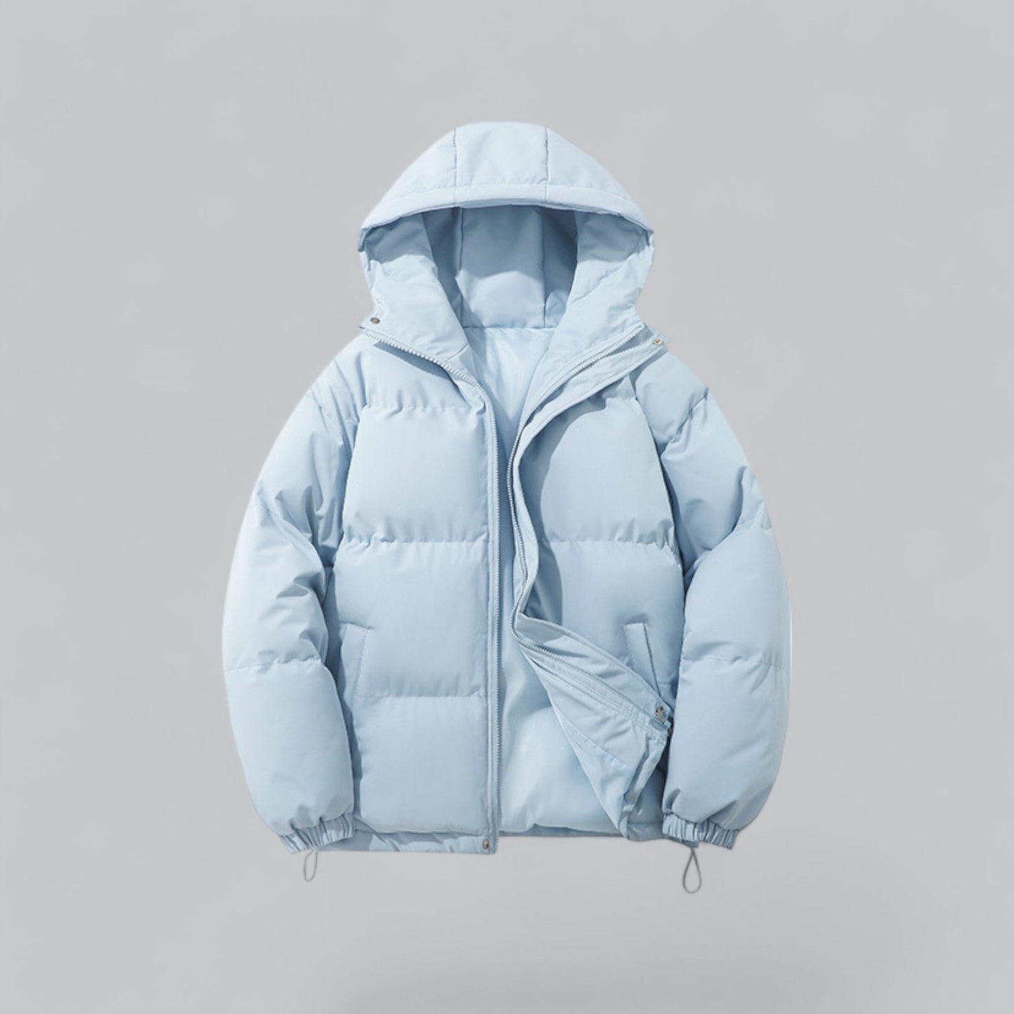 Light blue puffer jacket on a gray background