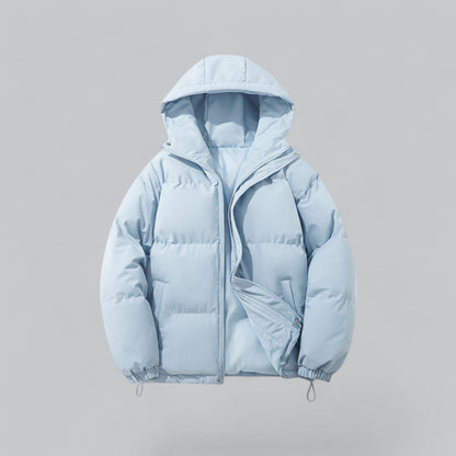 Light blue puffer jacket on a gray background