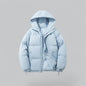 Light blue puffer jacket on a gray background