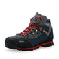 Hiking boot with red laces on a white background