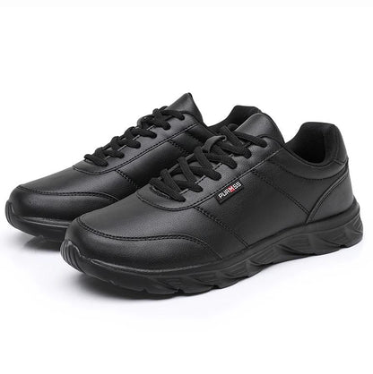 Pair of black sneakers on a white background