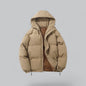 Beige puffer jacket with a hood on a light gray background