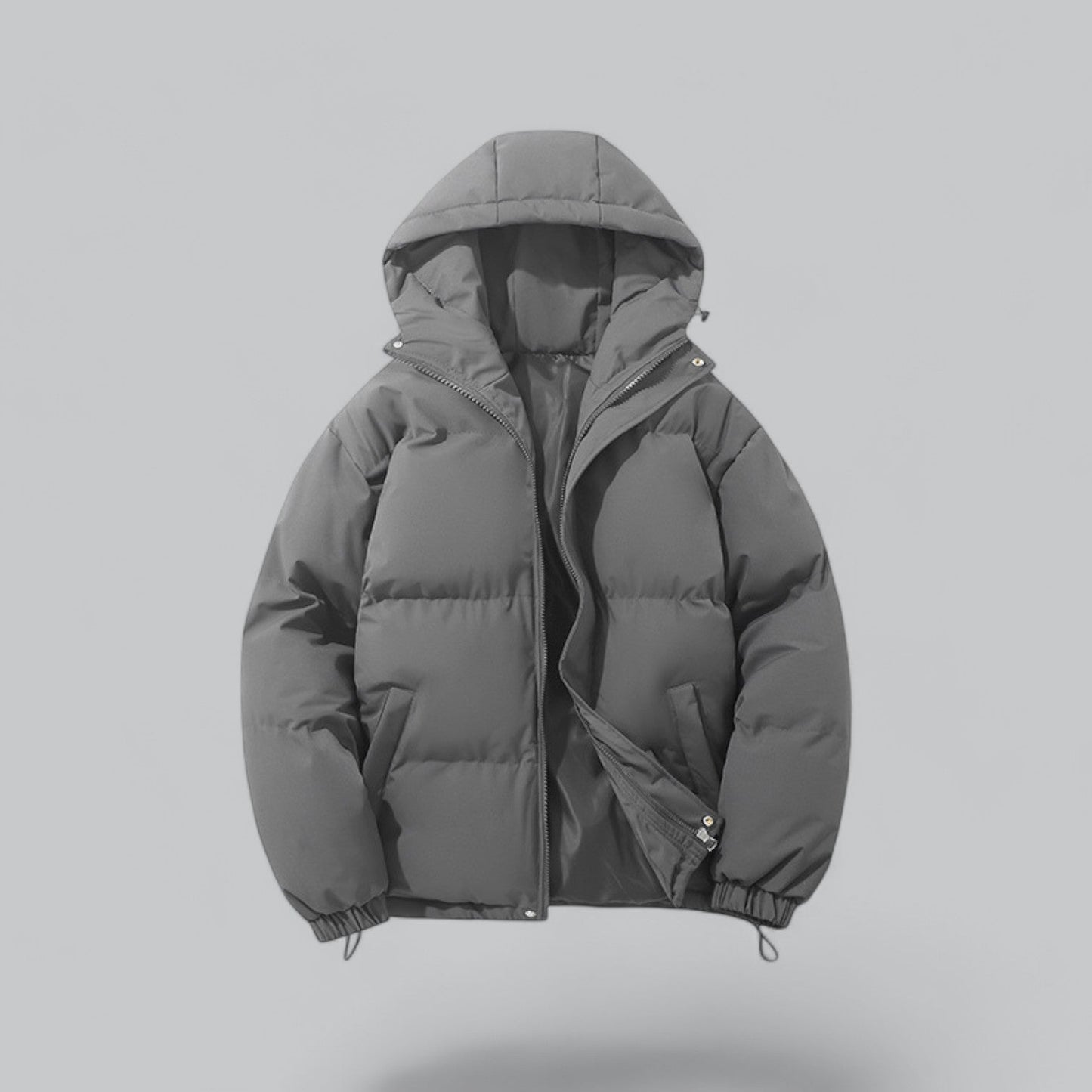 Gray puffer jacket on a light gray background