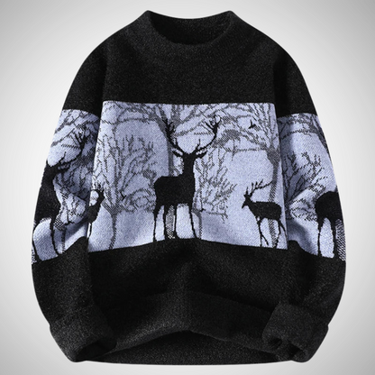 Black sweater with deer pattern on a light gray background
