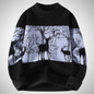 Black sweater with deer pattern on a light gray background