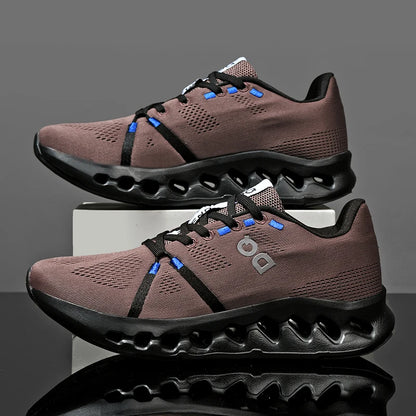 Pair of brown running shoes with black soles on a reflective surface.