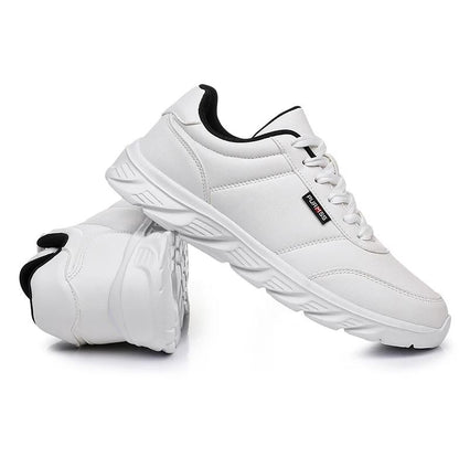 White sneakers with black accents on a white background